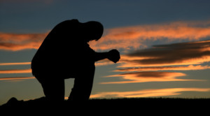 Silhouette of a Man Praying